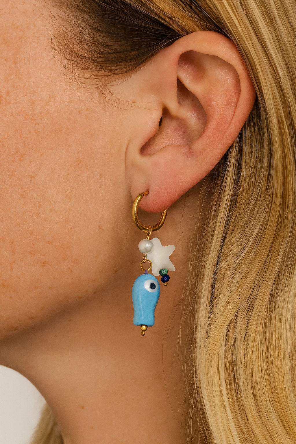 Stainless steel goudkleurige creolen met blauwe vis en ster