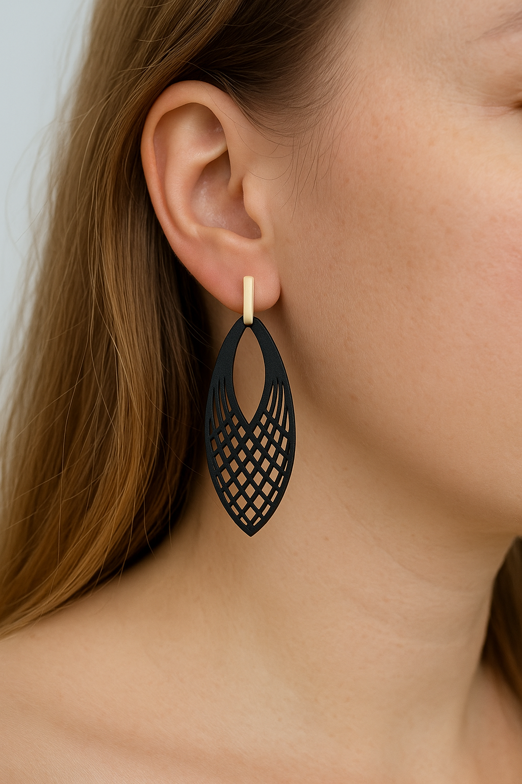 Witte staafjes met zwarte oog hangers