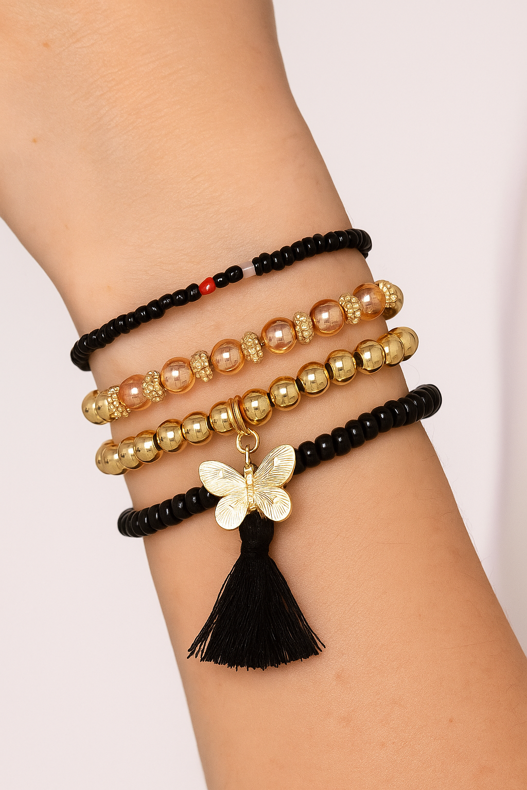Set van 5 zwarte armbanden met vlinder en floche