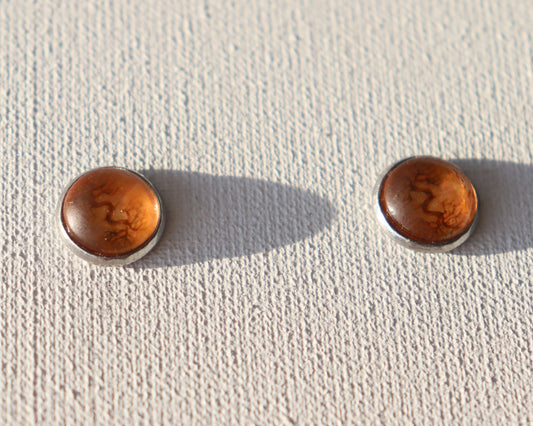 Zilverkleurige oorstekers met oranje boom( chirurgisch roestvrij staal)